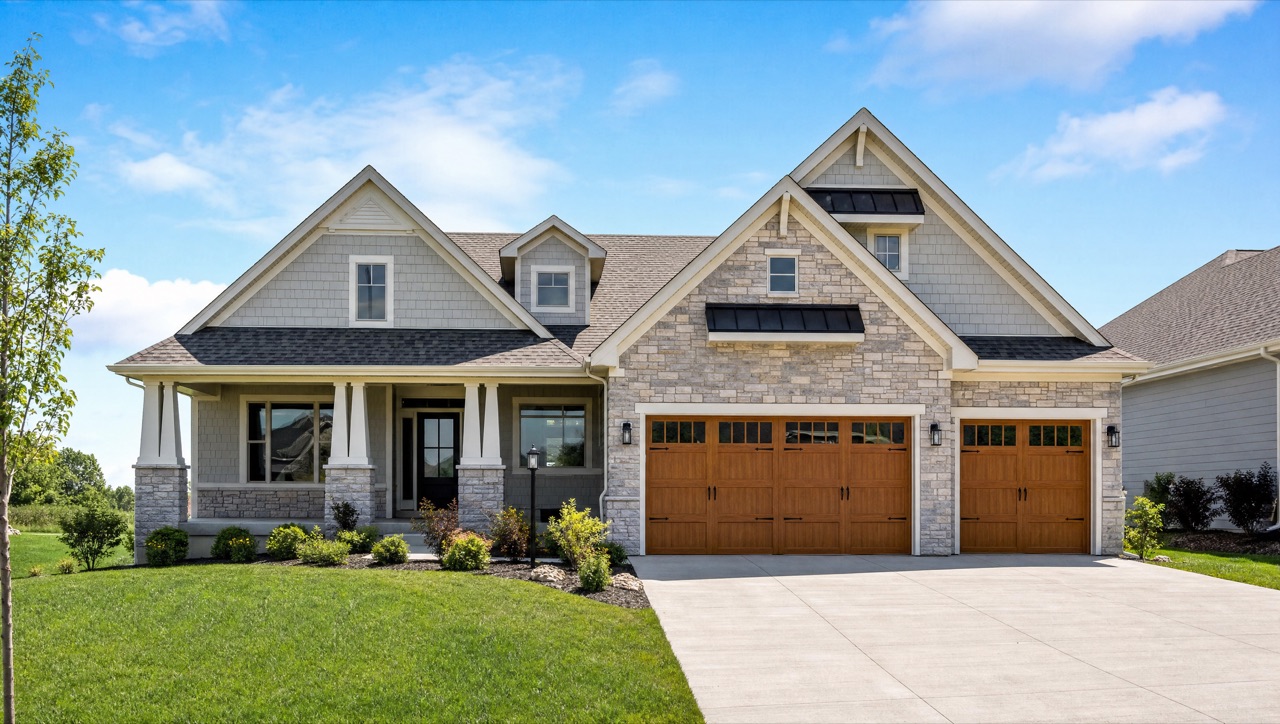 A new-construction model home with a three-car garage